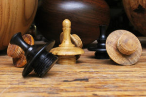 assorted wood finials for sealing cremation urns