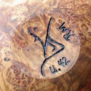 wood species mark on bottom of an urn